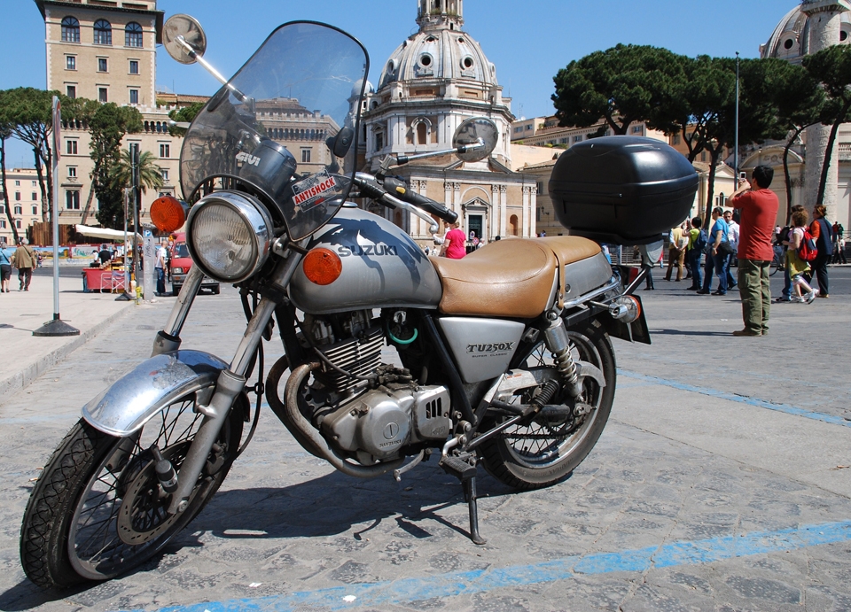The Tourist and the Motorbike: Exploring Historical Rome. 
All roads lead to Rome and the motorbike allows the tourist to ride all of them – from the wide avenues to the narrow sidestreets that lead to it’s very heart. Tourism is integral to Rome itself, and to the lives of the people who live and adventure here. 