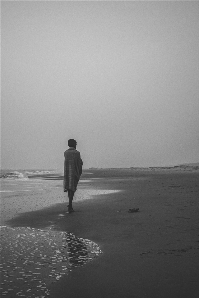 Watching and awaiting his family from the sea 