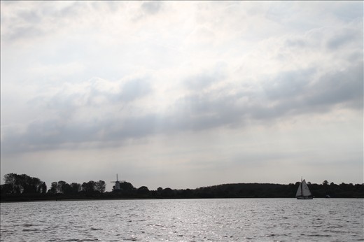 The sun breaks through the clouds. It is a beautiful day to sail, in Zeeland, the most southwestern province of the Netherlands