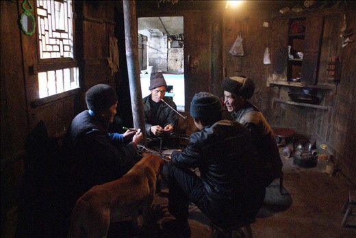 Six hours after the initial cut, the family sits down to dinner, men take a smoke, and eat first. Mei Mei sits in the other room with the women and waits to eat.