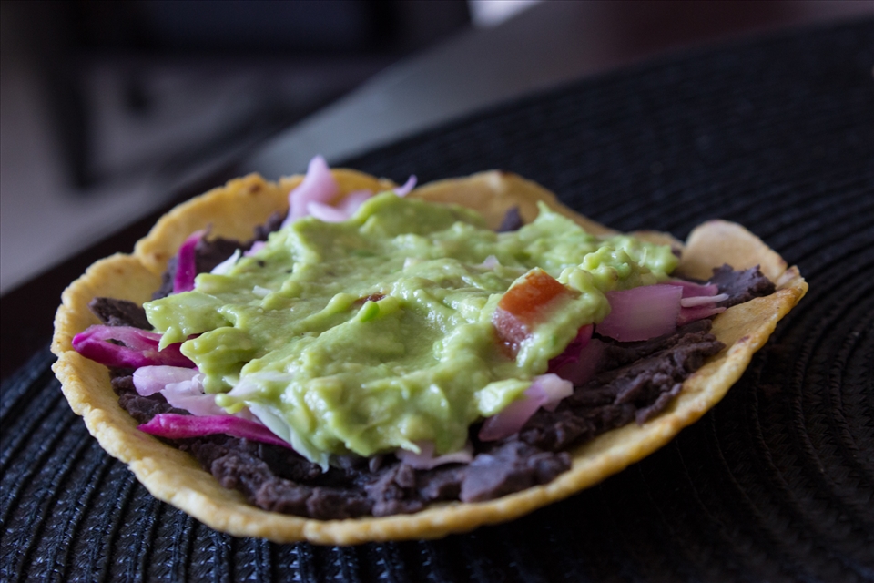 My favourite: tostada, refried beans, pickled cabbage & guacamole.
