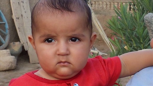 Young boy. I am using the voice command to write the picture tdescription. When the call to prayer comes over the loudspeaker at the mosque, it is so loud it sends the voice command into chaos,I have to hold my ears. I'll try to do a video with audio somewhere along the line so you can hear the call to prayer.