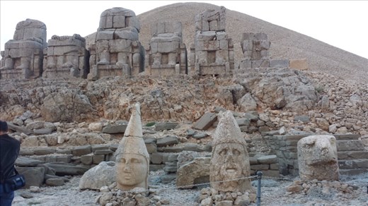 The heads of the gods were originally on the stone structures behind them. Mt. Nemrut.