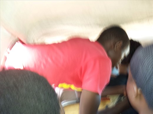 Mini bus, 18or19 of us. The guy in the red shirt is standing on the outside of the bus collecting fares as we drive down the road