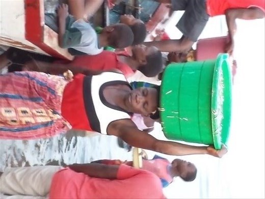 I'm beyond frustrated with the picture rotation. Seems to happen on my favorite pictures. This women is incredible, hauling fish and water through 50 yds of soft sand to the processing area