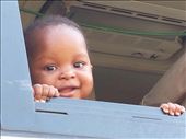 Cute little girl looking out the window of our broken down bus.: by lipowcan8, Views[537]