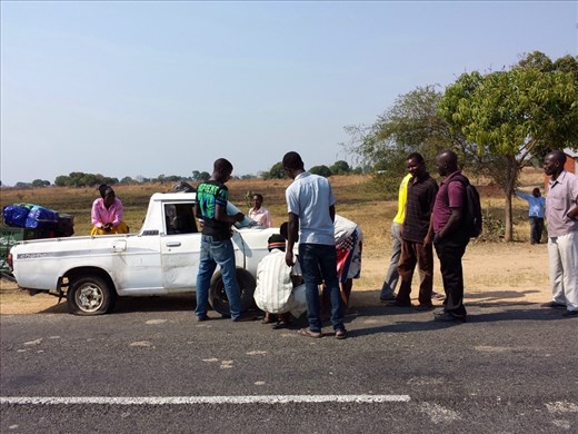 18 or 19 of us in this truck. Age or being an out of towner I had the front seat. 2 flat tires, the passengers lifted the rear end to help change the tires. A day in the life..... no one seemed to be bothered.


