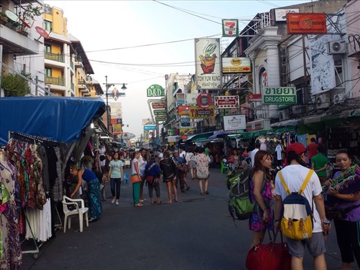Khao San Road, Bangkok. It's referred to as the backpackers ghetto. Fun place to walk around and have a couple of beers.  