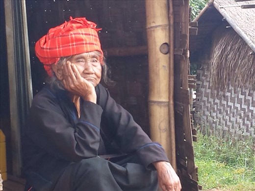 Sitting in the doorway of her house in one of the villages where we slept. Notice the spots in the picture. I checked my camera lens, it was clean. Maybe flying insects? I like the picture, not the spots.