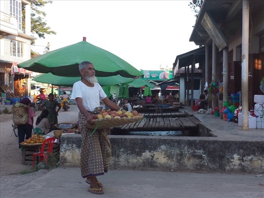 Merchant returning unsold produce at the end of the day.