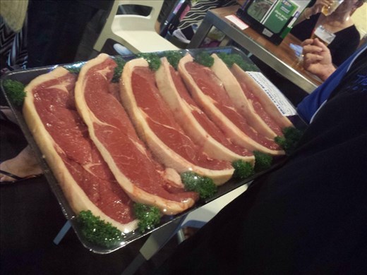 It's a popular way of fundraising for clubs, sport groups etc. A meat auction in the local bars, buy a ticket for a dollar and take your chances.