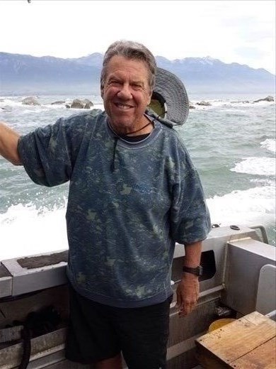 On the boat, snow on top of the distant mountains