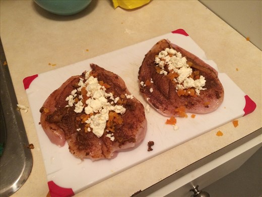 Assembling the chicken prior to tying together with cooking twine.