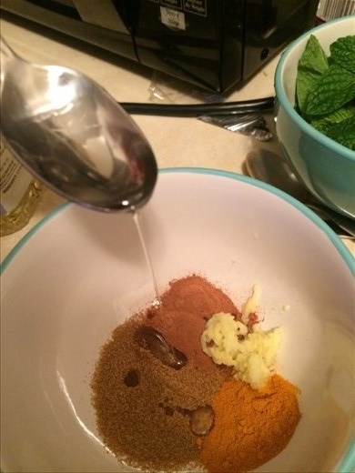 A fine close up of the spices used to form the paste to rub into the chicken.