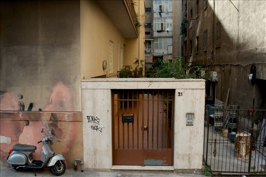Scootering about: Scooters, scooters everywhere! When I think of Sicily, it evokes images of scooters. I didn't realise why scooters are so popular until I visited Italy and now I know why. The streets are often very narrow and traffic is chaotic. There are road rules in Sicily, however it is apparent that there are unspoken rules that the locals seem to follow. This photo was taken in a side street of Palermo, the capital of Sicily. I like the contrast of the shiny, new looking scooter and the darkness of alleyway down the side of the building and the grafitti on the walls. To me this is authentic Sicily. A land of many contrasts: beautifully dressed men and women in designer clothes walking through the high class shops in town, avoiding the dog faeces and rubbish on the street; magnificent tasting food, only consisting of two or three simple ingredients; desserts for breakfast, served with healthy fresh fruits. I would like to think, that this, my heritage explains so much of my contrasting habits and behaviours.