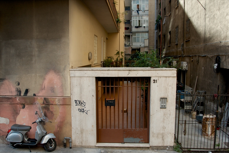 Scootering about: Scooters, scooters everywhere! When I think of Sicily, it evokes images of scooters. I didn't realise why scooters are so popular until I visited Italy and now I know why. The streets are often very narrow and traffic is chaotic. There are road rules in Sicily, however it is apparent that there are unspoken rules that the locals seem to follow. This photo was taken in a side street of Palermo, the capital of Sicily. I like the contrast of the shiny, new looking scooter and the darkness of alleyway down the side of the building and the grafitti on the walls. To me this is authentic Sicily. A land of many contrasts: beautifully dressed men and women in designer clothes walking through the high class shops in town, avoiding the dog faeces and rubbish on the street; magnificent tasting food, only consisting of two or three simple ingredients; desserts for breakfast, served with healthy fresh fruits. I would like to think, that this, my heritage explains so much of my contrasting habits and behaviours.