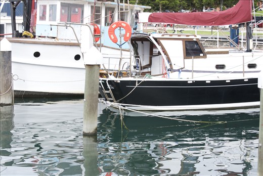 Restored boats resting in the marina.