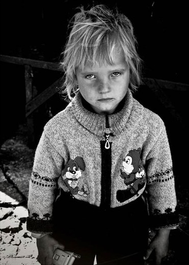 A little girl from Eastern Europe with eyes of the old woman in Palermo  