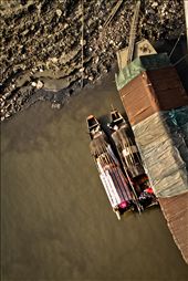 Boats docked alongside the muddy banks of the Yangtze River in the city of Wuhan, capital of central China's Hubei Province. These small vessels are used to transport goods down the city's system of canals.: by littletrades, Views[556]