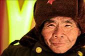 A gracious man dressed in an old army coat and hat at a McDonald's in a tourist area of the city of Wuhan, capital of central China's Hubei Province. Each day he spends his time offering to take people's trays away for a little bit of change.: by littletrades, Views[1131]