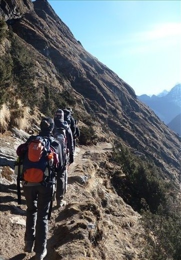Single File- the great ascent begins. Trekkers are focused and full of energy as they climb up through the dry and dusty terrain. 