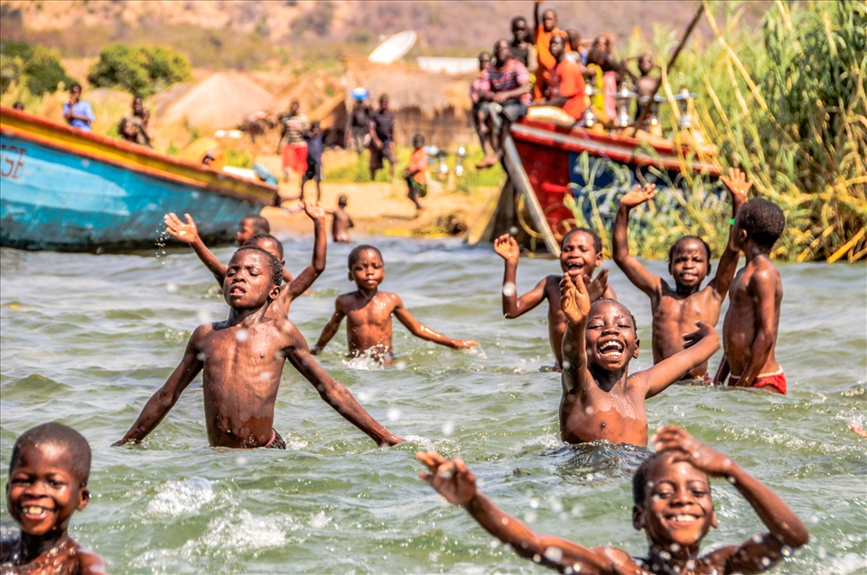 Children play after fishing during a harsh day in the Lake Tanganyika. Zambia