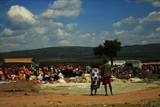 You see them smiling, in torn floral rags.You see them smiling in hunger and poverty.It is a glimpse of love in a Masai Bazaar.No brands.No glitz..You get blue sky with every buy:Free! Free!Free!
