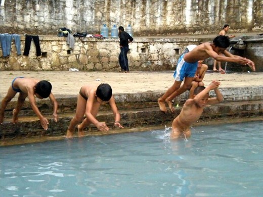 Children cool in the hot summer month in Nepal
