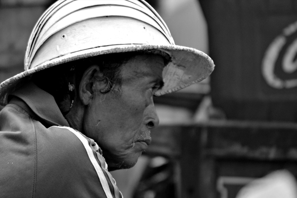 A bicycle taxi driver waiting for passenger at 