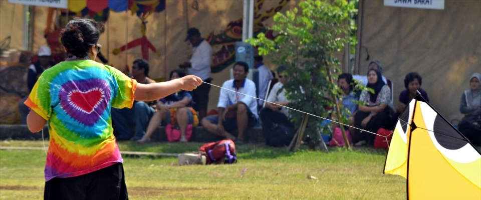 A kite lover flew her kite on the International Kite Festival in Jakarta