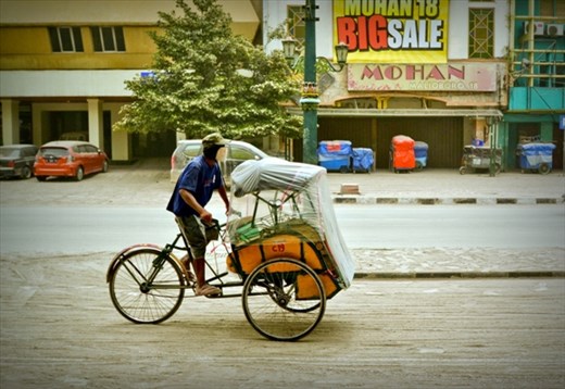 Pedicab. Jogjakarta covered with ash from Kelud volcano eruption.