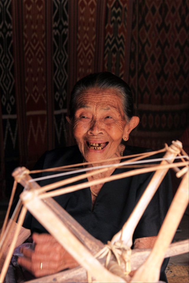 Meanwhile, an old woman next door selling cloth to pay her funeral later