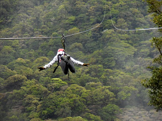 Katelyn Kennon soars over the rain forest canopy, ziplining in Monteverde.