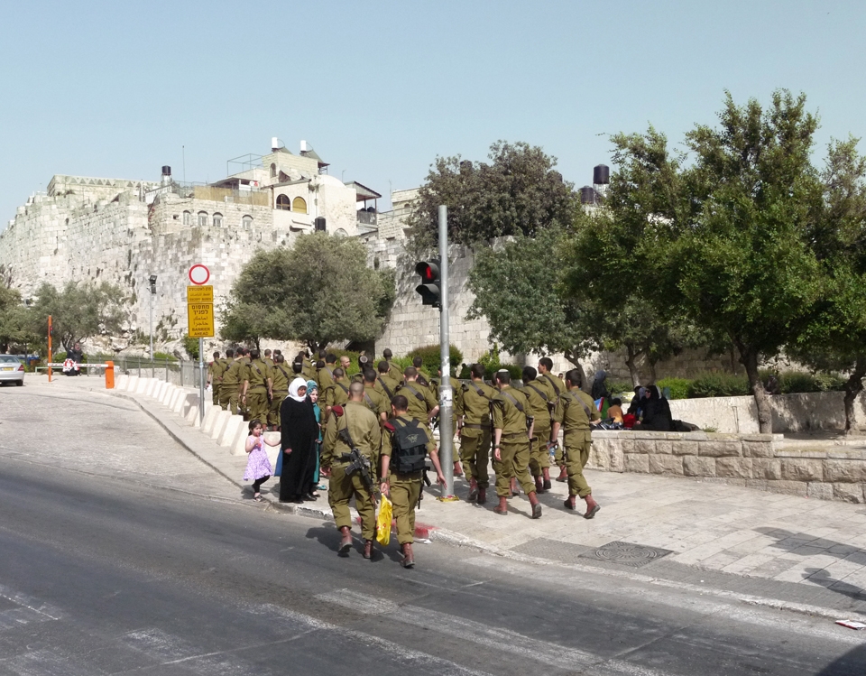 #1 A Congested Footpath:  It could be argued that you don’t need the slightest photographic nous to take a decent shot in Jerusalem, such is aura of the city and its abundance of sites. Never really one for sites and attractions, I wanted to focus on the innocuous moments of daily life in the city; the underlying tension, the contrasts, the joy, the innocence. It didn’t take long before I witnessed my first key moment. I was exploring East Jerusalem, the Arab district, when swathes of young Israeli soldiers casually entered in separate groups, in their hundreds, walking through what appeared to be a fixed route. What struck me was how nonchalant everyone was, both the locals of East Jerusalem toward the soldiers, and vice versa. It was as if neither side knew the other was there. The sentiment is captured here, if you observe the lady in the shot, you’ll see she is looking at the ground, which she did until the soldiers had cleared. It was one of several fascinating scenes.