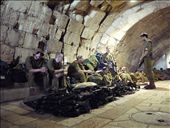 #4 A Moments Rest:  It seemed wherever I was in Jerusalem, I was never far from soldiers. I’d seen a machine gun before, but never a large, neatly stacked pile of them.  I was a little apprehensive about pulling my camera out, but thought I’d regret it if I didn’t. I was given a friendly nod from one of the soldiers, meaning approval was granted, and subsequently took the photo. I think this shot, taken in the old city, accurately reflects the mood and disposition of many of the young, off-duty soldiers I saw. They generally appeared relaxed and chatting, which always made for an interesting juxtaposition when cast against machine guns. There was also a strong sense of comradery between the groups of soldiers I saw, which seems to be typical of young Israelis today. It can be seen not only in the foreground, with the soldier smiling whilst chatting to those seated, but also further back in the shot, where soldiers are all laying down next to each other across their backpacks, limbs intertwined.: by lofiadrian, Views[293]