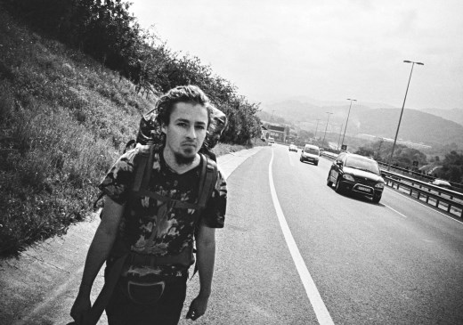 walking down the highway in spain to get to a good hitchhicking spot