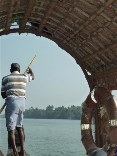 Strongly and surely he guides us down the rivers in Kerala, he has been a thousand times before.