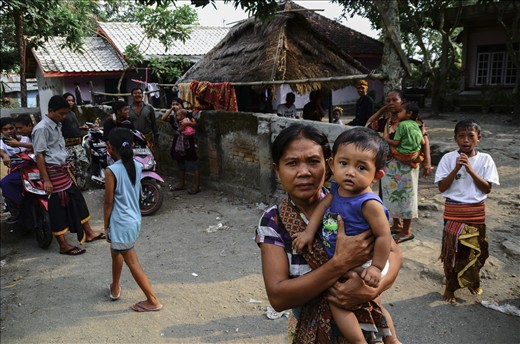 the groom's relatives and other villagers gather together at the house of his parents to celebrate the second day of the wedding ceremony. A big variety of local dishes was offered. Sasak people sharing their tradition and custom with incredible devotion.