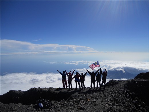 Malay Team stood  together in the summit after hours waiting for some members 