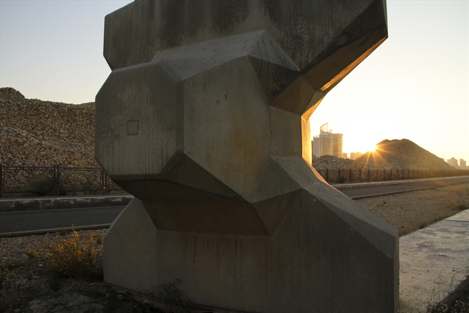Reminiscent of an emerging Gulf mega polis, the new facade of the city center is a striving still in the making at a distance. But in a moment, two bikers are about to gush out into the sunset from behind the giant cyclopean breakwater, unsuspected...