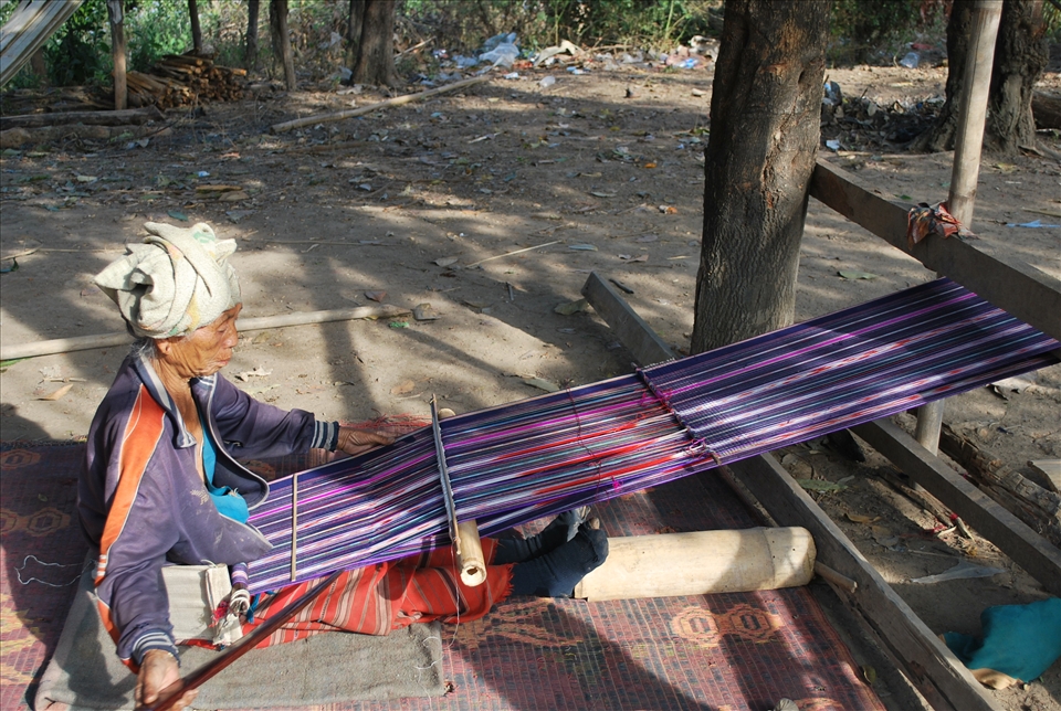 Long hours are spend by the tribe women making scarfs to sell. 