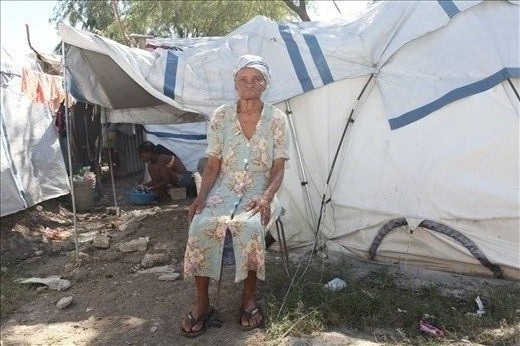 In Haiti voodoo is widely practiced. Noticing I was carrying a camera, this lady came over and informed me that there is a strong voodoo belief-especially among older Haitians-that when someone takes your photo it steals your soul. I felt extremely privledged and it took me by surprise, when she offered to have her portrait taken.