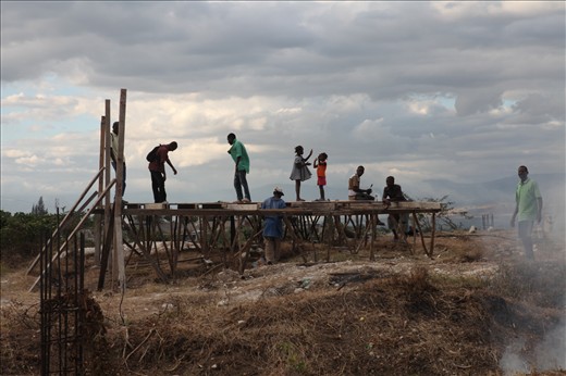 My day was coming to an end and I was making my way back to the team house when I spotted a group of men rebuilding a structure on top of a hill. I was ecstatic to see this, for to me it symbolised the rebirth of Haiti after the Earthquake. To me it represented the resilience, pride and determination the Haitians have. Even though most have lost everything including loved ones, they still wear a smile on their face and remain hopeful that things will get better. They make something out of nothing and life goes on somehow. 
