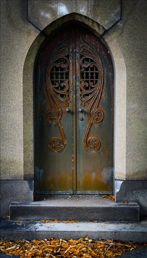 door to a cript in a cemetery