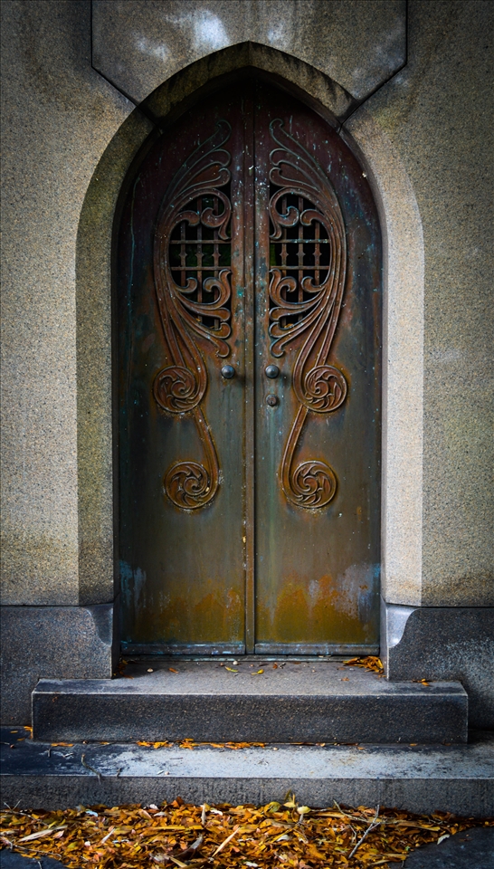door to a cript in a cemetery