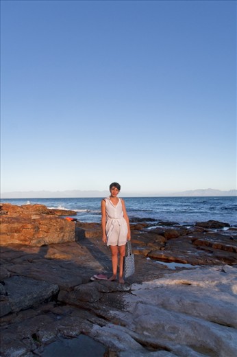 Naomi is an anthropology student, soon to leave Cape Town to pursue a scholarship  in Kentucky. She was born in Swaziland, a small nation that borders South Africa - surprising to many since her forbears are Ashkenazi jews from Latvia, who settled in Swaziland shortly after World War II.

She is seen here in Kalk Bay, named after the limestone (and chalk) that was quarried in this region. It's a small fisherman's village that is slowly being gentrified by the influx of holidaymakers, but still retains it's salty charm.