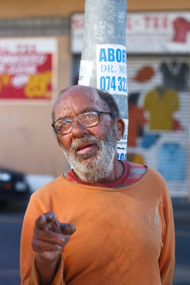 This bespectacled man is a regular in Salt River, a semi-residential area of bad repute that borders the industrial hub of Cape Town. I met him outside Fargo's trading - an outlet store frequented by Cape Town's muslim community for their huge range of spices and exotic food items. The abortion poster on the pole behind him is not an unusual sight.
