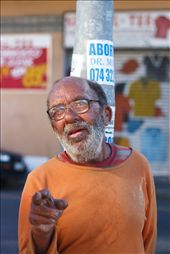 This bespectacled man is a regular in Salt River, a semi-residential area of bad repute that borders the industrial hub of Cape Town. I met him outside Fargo's trading - an outlet store frequented by Cape Town's muslim community for their huge range of spices and exotic food items. The abortion poster on the pole behind him is not an unusual sight.: by loverock, Views[694]