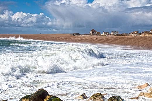 See the human context as massive waves crash down while winds meet