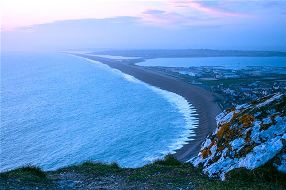 Dusk storm force 8 ravages a beach with deep trenches